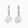 The 14K Yellow Gold Fresh Water Keshi Pearl Drop Earrings feature large, irregular Keshi pearls suspended from simple gold hooks, shown against a plain white background.