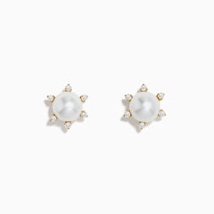 These 14K yellow gold earrings showcase a central freshwater pearl encircled by six sparkling diamonds arranged in a radiant pattern.