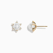 These 14K yellow gold earrings showcase a central freshwater pearl encircled by six sparkling diamonds arranged in a radiant pattern.