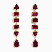 The 14K Yellow Gold Rhodolite Garnet Linear Drop Earrings feature five rhodolite garnets each in teardrop, triangle, and rectangle shapes, arranged vertically. Shown on a white background.