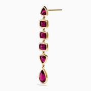 The 14K Yellow Gold Rhodolite Garnet Linear Drop Earrings feature five rhodolite garnets each in teardrop, triangle, and rectangle shapes, arranged vertically. Shown on a white background.