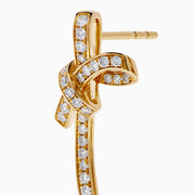 14K Yellow Gold Diamond Bow and Cultured Pearl Linear Drop Earrings, featuring diamond-studded bows and dangling cultured pearls, shown on a white background.