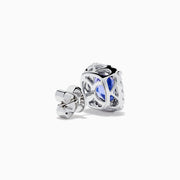 The Effy Hematian 18K White Gold Tanzanite and Diamond Cushion Halo Stud Earrings feature vibrant deep blue cushion-cut tanzanites, each encircled by a halo of sparkling white diamonds.