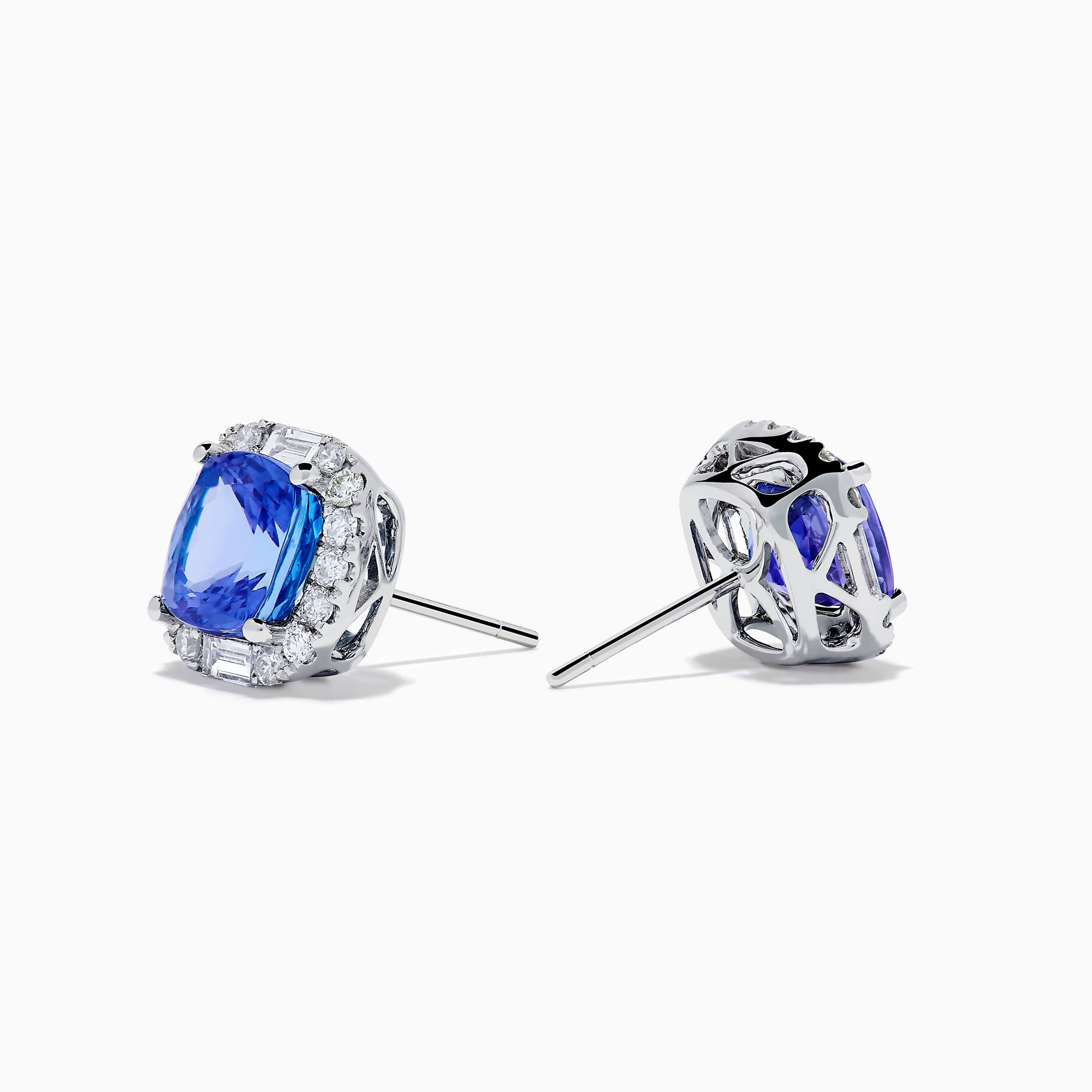 The Effy Hematian 18K White Gold Tanzanite and Diamond Cushion Halo Stud Earrings feature vibrant deep blue cushion-cut tanzanites, each encircled by a halo of sparkling white diamonds.