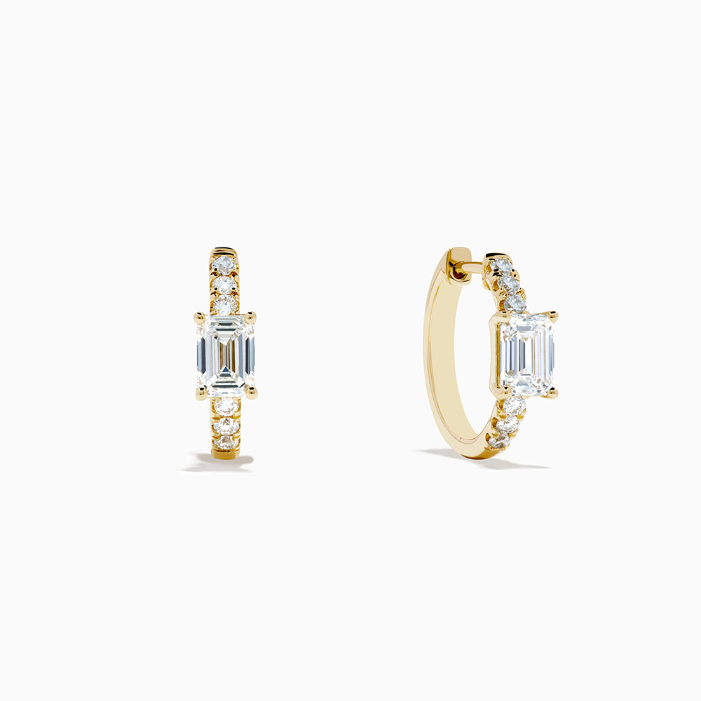 Lab Grown Diamond Emerald-Cut Huggie Earrings in 14K Yellow Gold, each with a central rectangular lab diamond and small round diamonds on the hoop, shown on a white background.