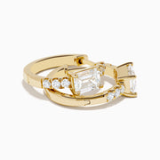 Lab Grown Diamond Emerald-Cut Huggie Earrings in 14K Yellow Gold, each with a central rectangular lab diamond and small round diamonds on the hoop, shown on a white background.