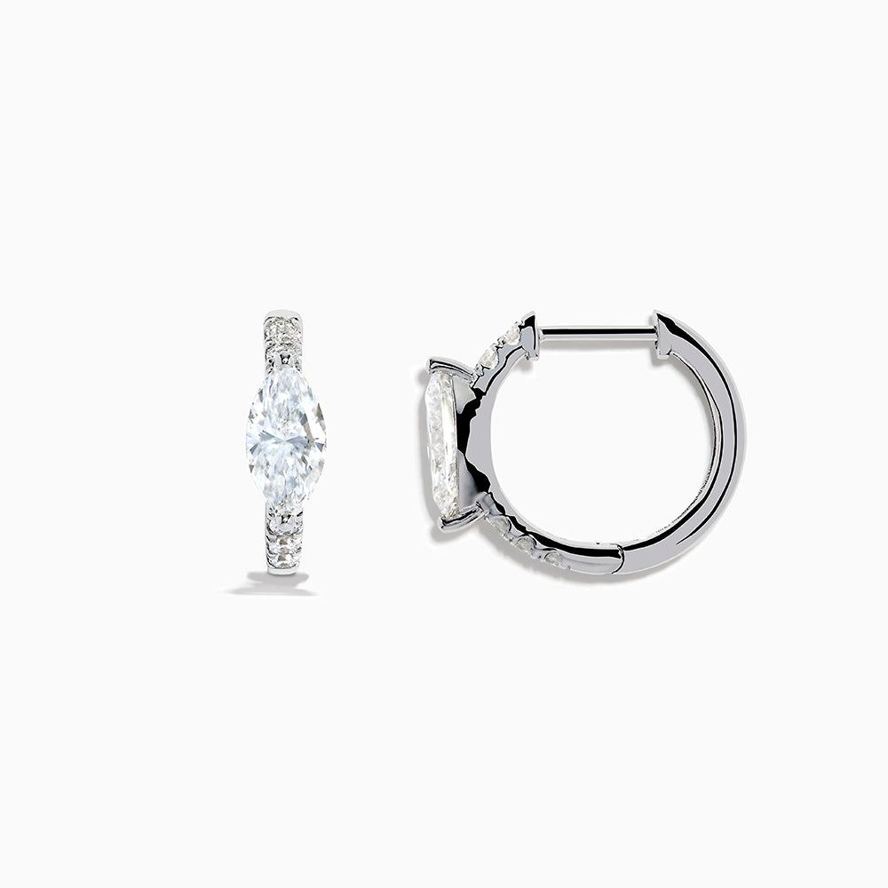 A pair of Lab Grown Diamond Marquise Huggie Earrings in 14K white gold, featuring dazzling lab-created gemstones, elegantly displayed on a plain white background.