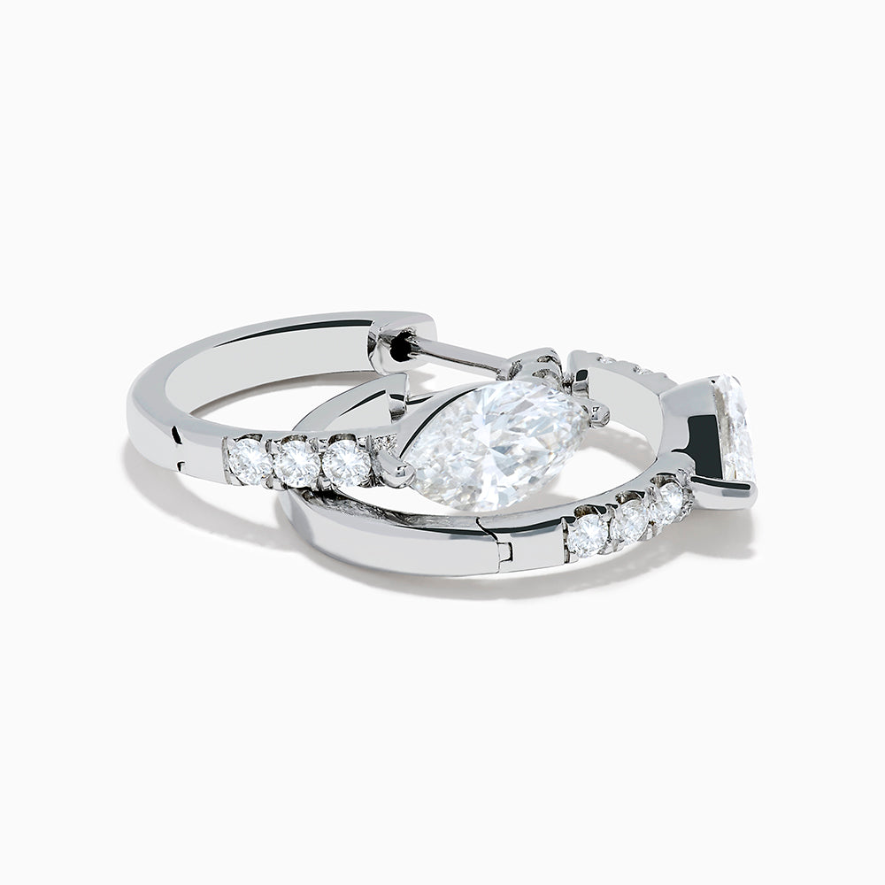 A pair of Lab Grown Diamond Marquise Huggie Earrings in 14K white gold, featuring dazzling lab-created gemstones, elegantly displayed on a plain white background.