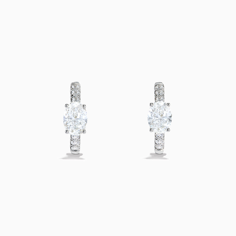 Lab Grown Diamond Oval Huggie Earrings in 14K White Gold, featuring sparkling lab diamonds set along sleek hoops, displayed on a white background.