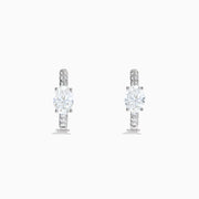 Lab Grown Diamond Oval Huggie Earrings in 14K White Gold, featuring sparkling lab diamonds set along sleek hoops, displayed on a white background.