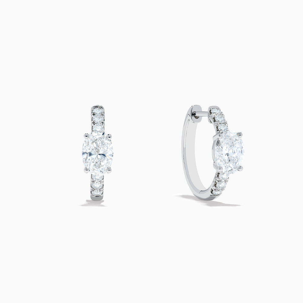 Lab Grown Diamond Oval Huggie Earrings in 14K White Gold, featuring sparkling lab diamonds set along sleek hoops, displayed on a white background.