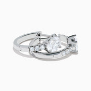 Lab Grown Diamond Oval Huggie Earrings in 14K White Gold, featuring sparkling lab diamonds set along sleek hoops, displayed on a white background.