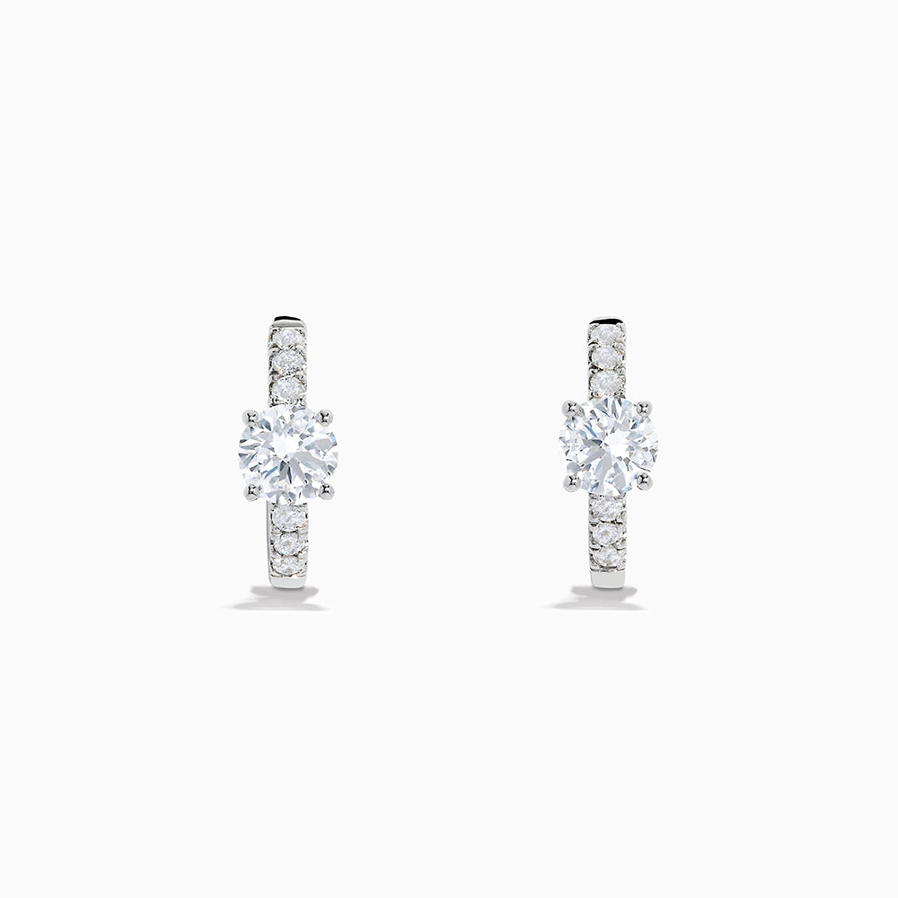 Lab Grown Diamond Round Huggie Earrings in 14K White Gold, featuring a central round diamond with vertical rows of smaller diamonds, displayed on a plain white background.