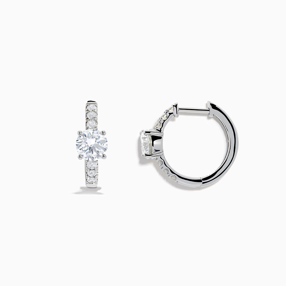 Lab Grown Diamond Round Huggie Earrings in 14K White Gold, featuring a central round diamond with vertical rows of smaller diamonds, displayed on a plain white background.