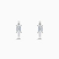 A pair of Lab Grown Diamond Emerald-Cut Huggie Earrings in 14K White Gold, each featuring a vertically set emerald-cut lab diamond at the front, displayed against a plain white background.