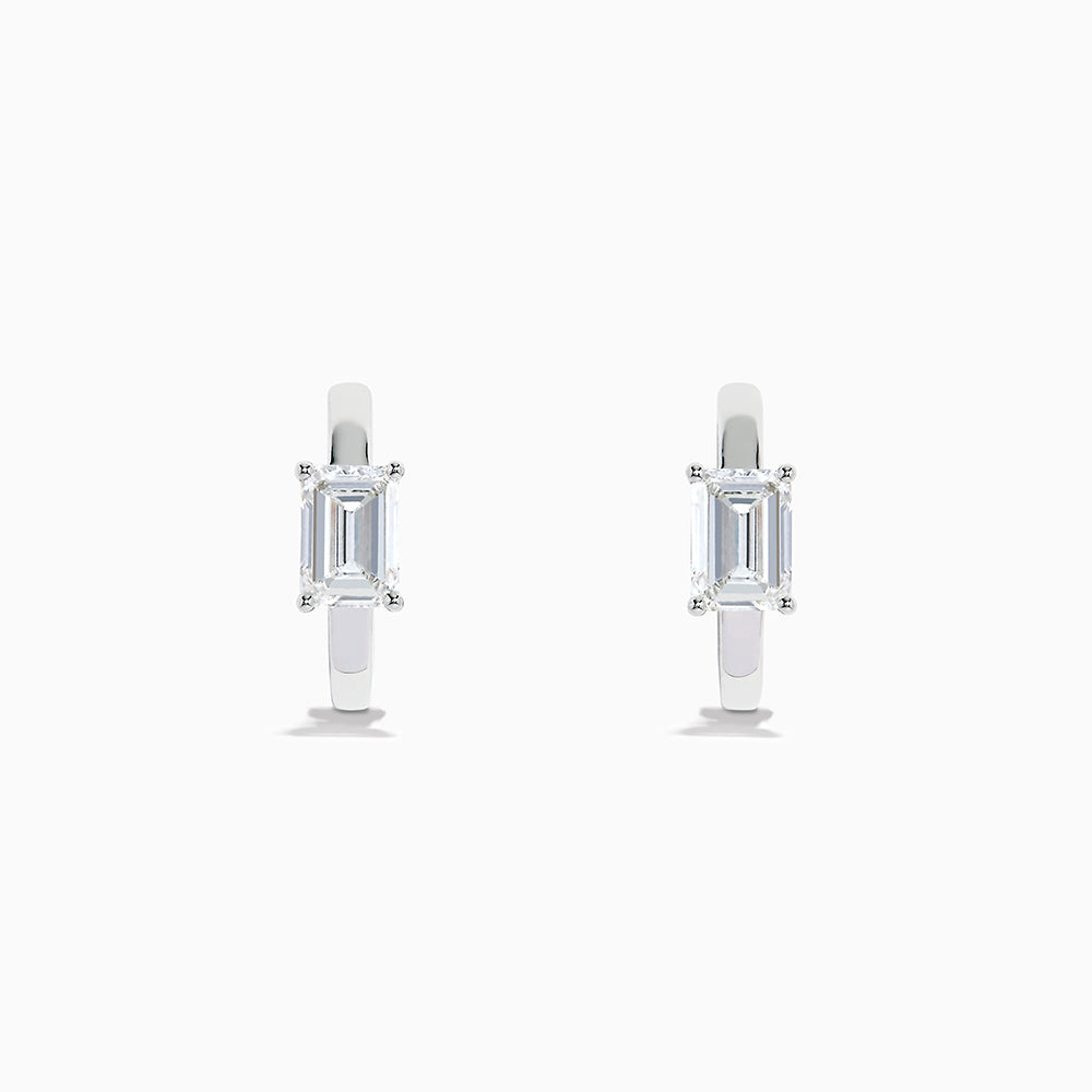 A pair of Lab Grown Diamond Emerald-Cut Huggie Earrings in 14K White Gold, each featuring a vertically set emerald-cut lab diamond at the front, displayed against a plain white background.