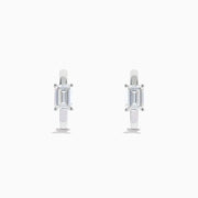 A pair of Lab Grown Diamond Emerald-Cut Huggie Earrings in 14K White Gold, each featuring a vertically set emerald-cut lab diamond at the front, displayed against a plain white background.
