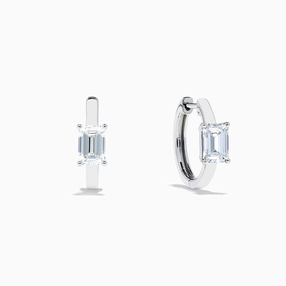 A pair of Lab Grown Diamond Emerald-Cut Huggie Earrings in 14K White Gold, each featuring a vertically set emerald-cut lab diamond at the front, displayed against a plain white background.