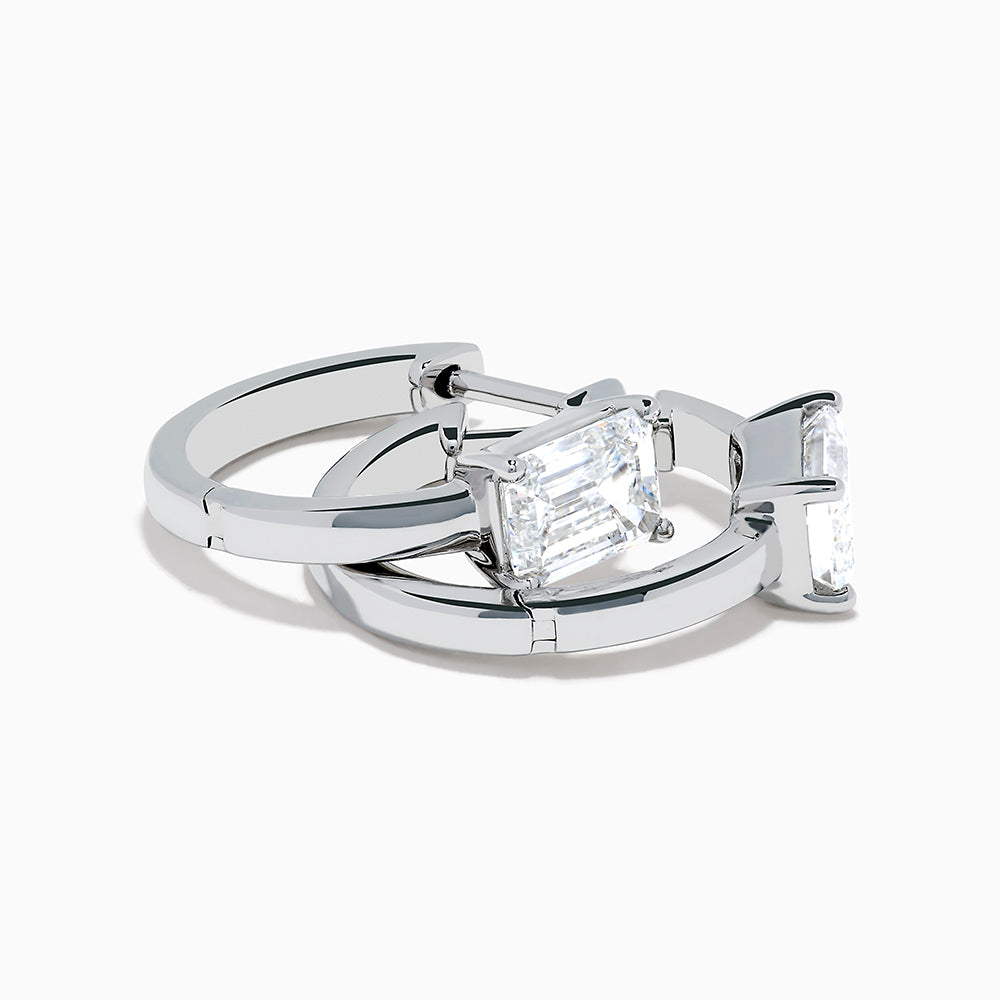 A pair of Lab Grown Diamond Emerald-Cut Huggie Earrings in 14K White Gold, each featuring a vertically set emerald-cut lab diamond at the front, displayed against a plain white background.