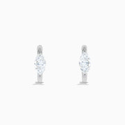 The Lab Grown Diamond Marquise Huggie Earrings in 14K White Gold are shown against a plain white background.
