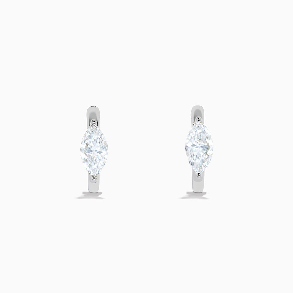 The Lab Grown Diamond Marquise Huggie Earrings in 14K White Gold are shown against a plain white background.