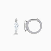 The Lab Grown Diamond Marquise Huggie Earrings in 14K White Gold are shown against a plain white background.
