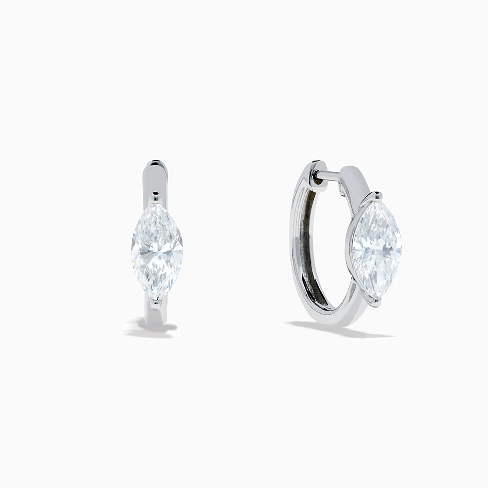 The Lab Grown Diamond Marquise Huggie Earrings in 14K White Gold are shown against a plain white background.