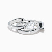 The Lab Grown Diamond Marquise Huggie Earrings in 14K White Gold are shown against a plain white background.