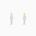 A pair of Lab Grown Diamond Marquise Huggie Earrings in 14K yellow gold, each with sparkling diamonds, shown against a plain white background.