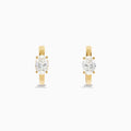 Lab Grown Diamond Oval Huggie Earrings in 14K Yellow Gold, each featuring a single oval lab grown diamond, displayed on a plain white background.