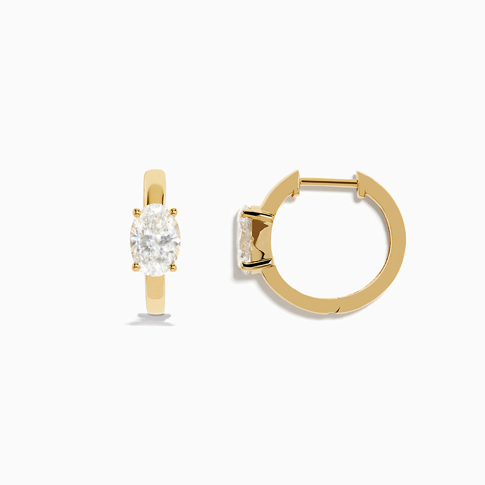 Lab Grown Diamond Oval Huggie Earrings in 14K Yellow Gold, each featuring a single oval lab grown diamond, displayed on a plain white background.