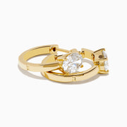 Lab Grown Diamond Oval Huggie Earrings in 14K Yellow Gold, each featuring a single oval lab grown diamond, displayed on a plain white background.