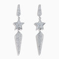 The 18K White Gold Diamond Shooting Star Linear Drop Earrings showcase a central star design with a long, pointed diamond-encrusted dangle, displayed on a plain white background.