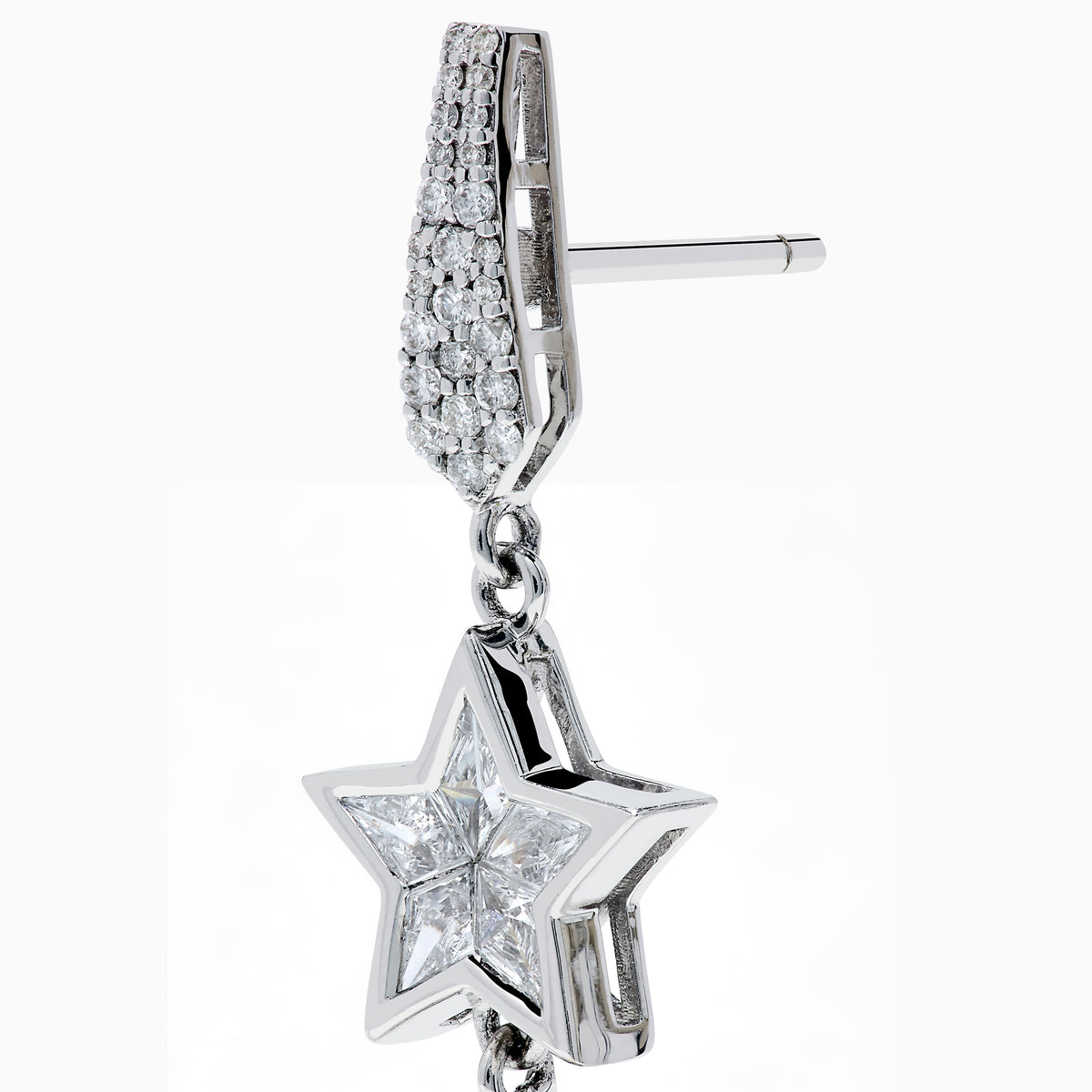 The 18K White Gold Diamond Shooting Star Linear Drop Earrings showcase a central star design with a long, pointed diamond-encrusted dangle, displayed on a plain white background.