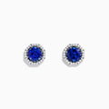 The Nahla Siri 14K Gold Octagon Cut Tanzanite and Diamond Earrings feature octagonal tanzanite gemstones encircled by small clear diamonds, set against a plain white background.