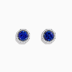 The Nahla Siri 14K Gold Octagon Cut Tanzanite and Diamond Earrings feature octagonal tanzanite gemstones encircled by small clear diamonds, set against a plain white background.