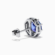 The Nahla Siri 14K Gold Octagon Cut Tanzanite and Diamond Earrings feature octagonal tanzanite gemstones encircled by small clear diamonds, set against a plain white background.