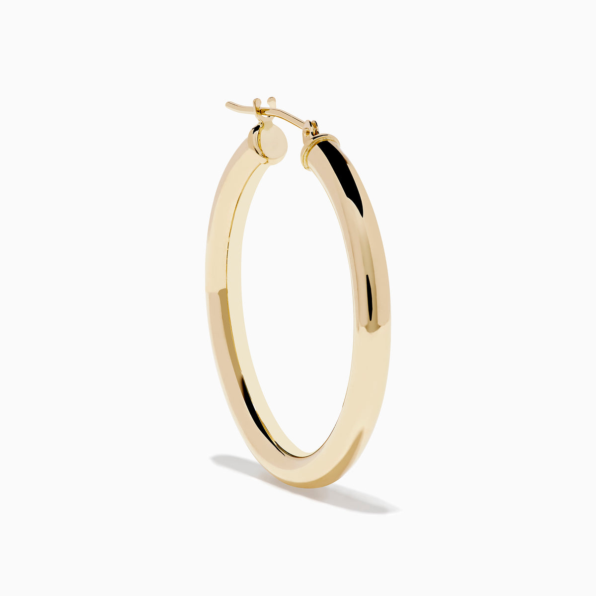 The 14K Yellow Gold Hollow Tube Hoops are sleek, polished earrings shown side by side against a white background, featuring classic yellow gold in a timeless hoop design with clasps at the top.