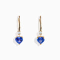 The Nahla Siri 14K Yellow Gold Tanzanite and Diamond Leverback Earrings feature heart-shaped tanzanite gems with a small diamond above each, shown against a white background.