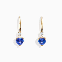 The Nahla Siri 14K Yellow Gold Tanzanite and Diamond Leverback Earrings feature heart-shaped tanzanite gems with a small diamond above each, shown against a white background.