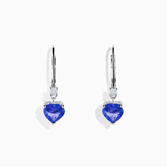 The Nahla Siri 14K White Gold Tanzanite and Diamond Leverback Earrings feature heart-shaped blue tanzanite stones accented with sparkling diamonds, shown on a white background.
