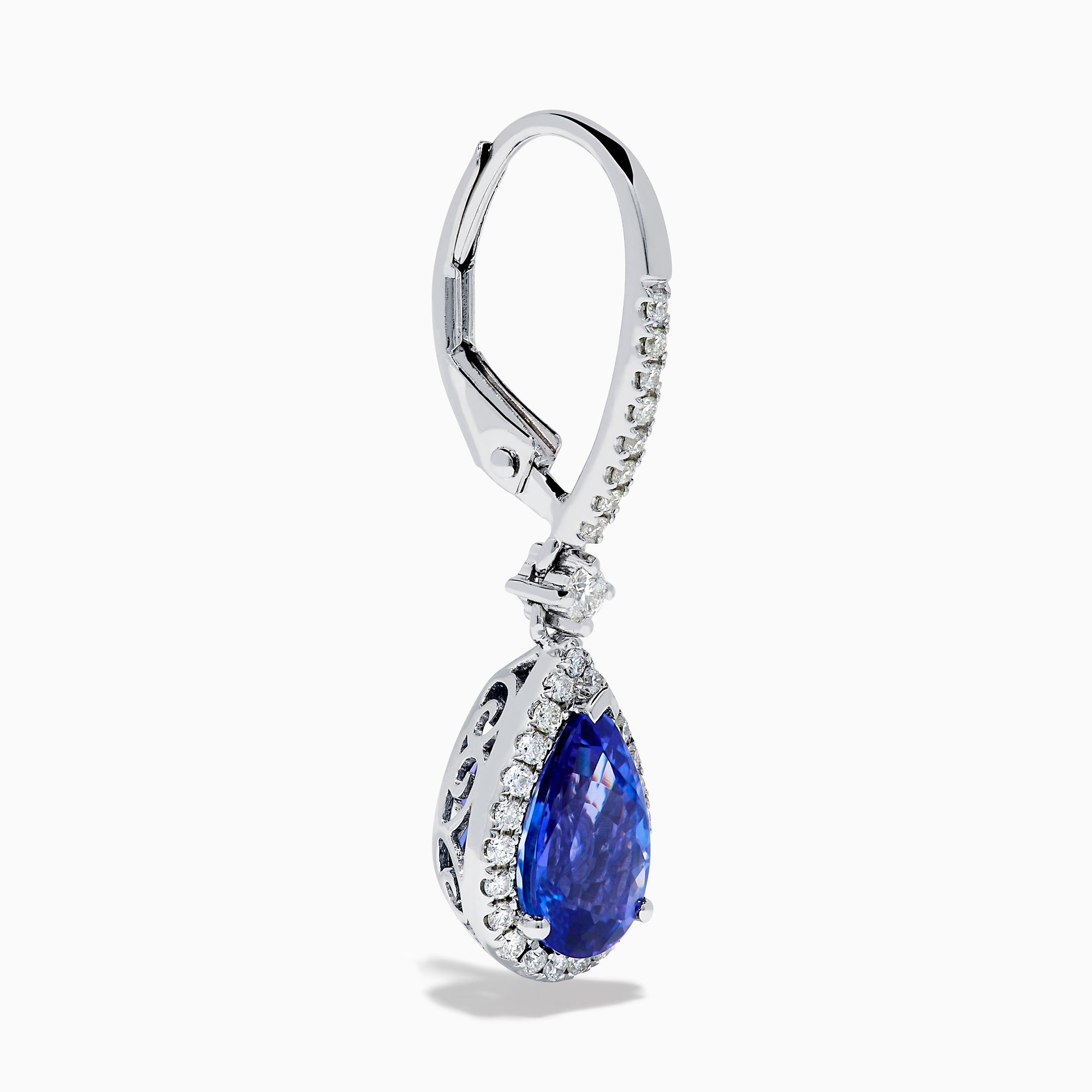 The Nahla 14K White Gold Tanzanite and Diamond Dangle Halo Earrings feature teardrop-shaped tanzanite stones surrounded by sparkling diamonds, set in elegant white gold and displayed against a white background.
