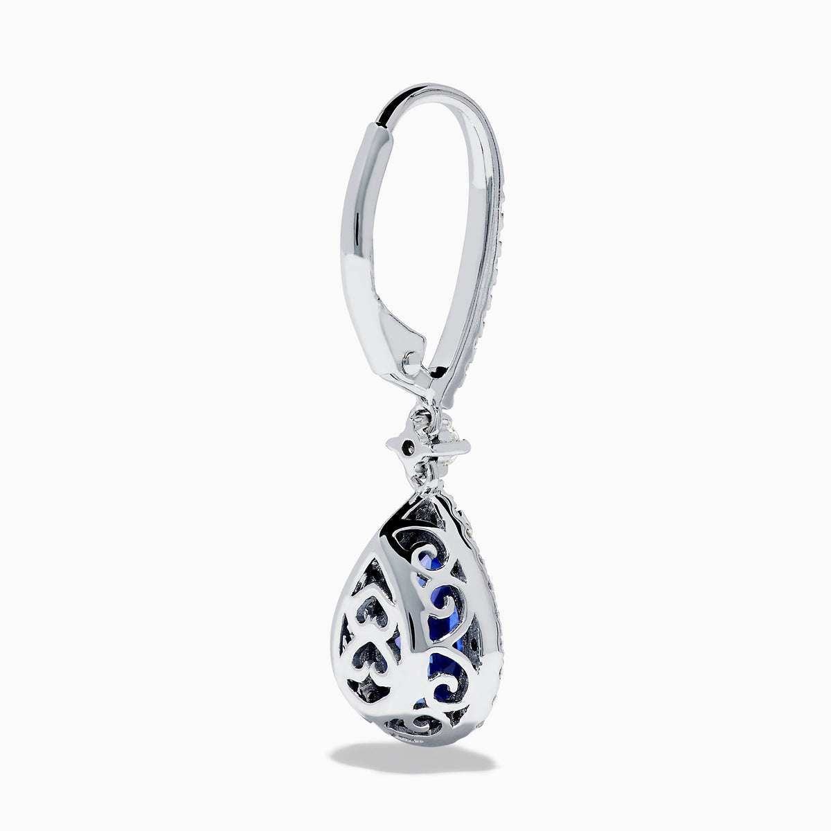 The Nahla 14K White Gold Tanzanite and Diamond Dangle Halo Earrings feature teardrop-shaped tanzanite stones surrounded by sparkling diamonds, set in elegant white gold and displayed against a white background.