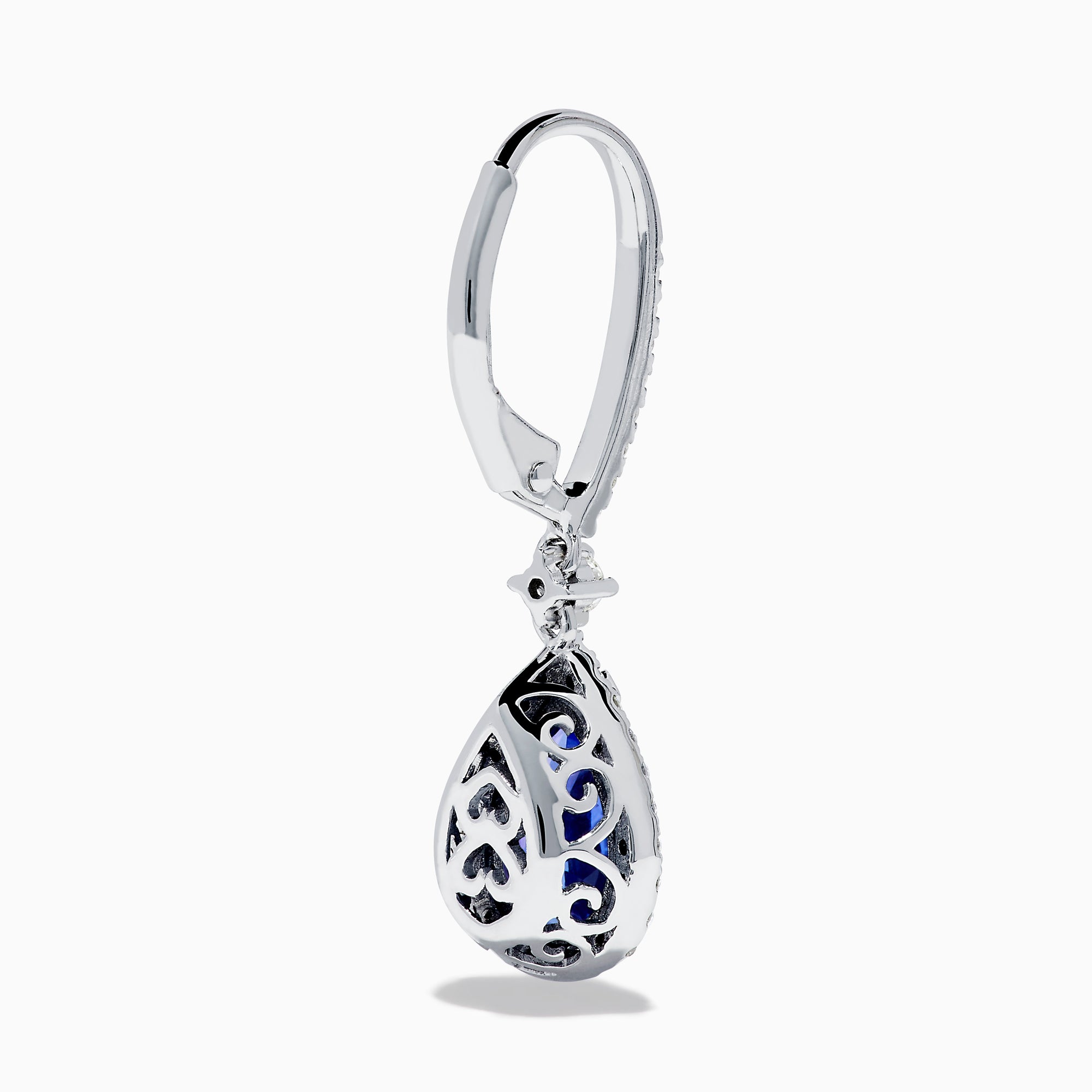The Nahla 14K White Gold Tanzanite and Diamond Dangle Halo Earrings feature teardrop-shaped tanzanite stones surrounded by sparkling diamonds, set in elegant white gold and displayed against a white background.
