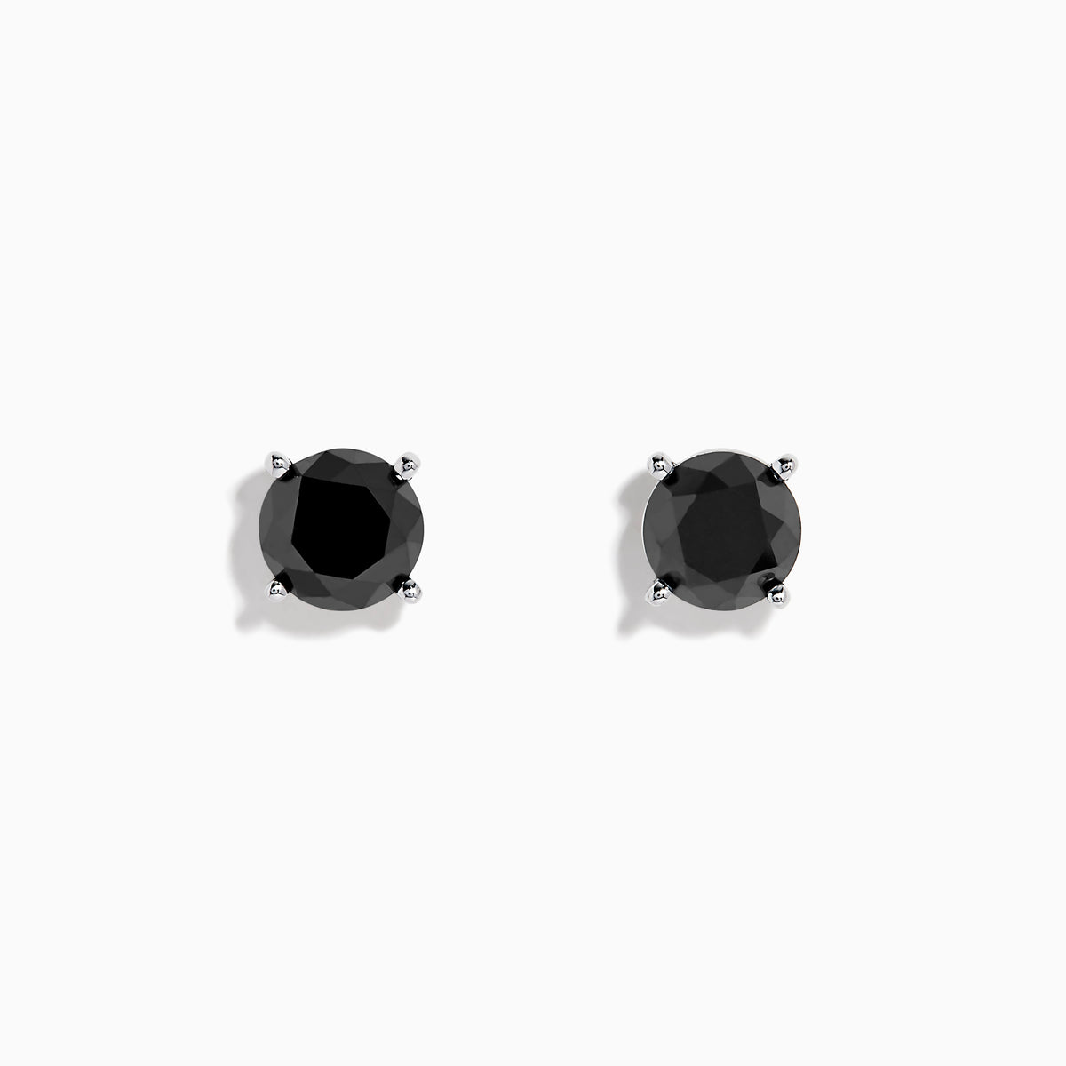 A pair of 14K white gold black diamond 4.00ct solitaire stud earrings with four-prong settings, shown against a plain white background.