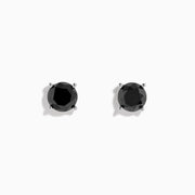 A pair of 14K white gold black diamond 4.00ct solitaire stud earrings with four-prong settings, shown against a plain white background.