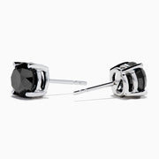 A pair of 14K white gold black diamond 4.00ct solitaire stud earrings with four-prong settings, shown against a plain white background.
