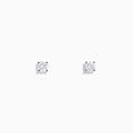 Two 14 karat white gold diamond stud earrings with 0.40TCW round diamonds shine in silver prong settings against a white background—perfect for timeless elegance.