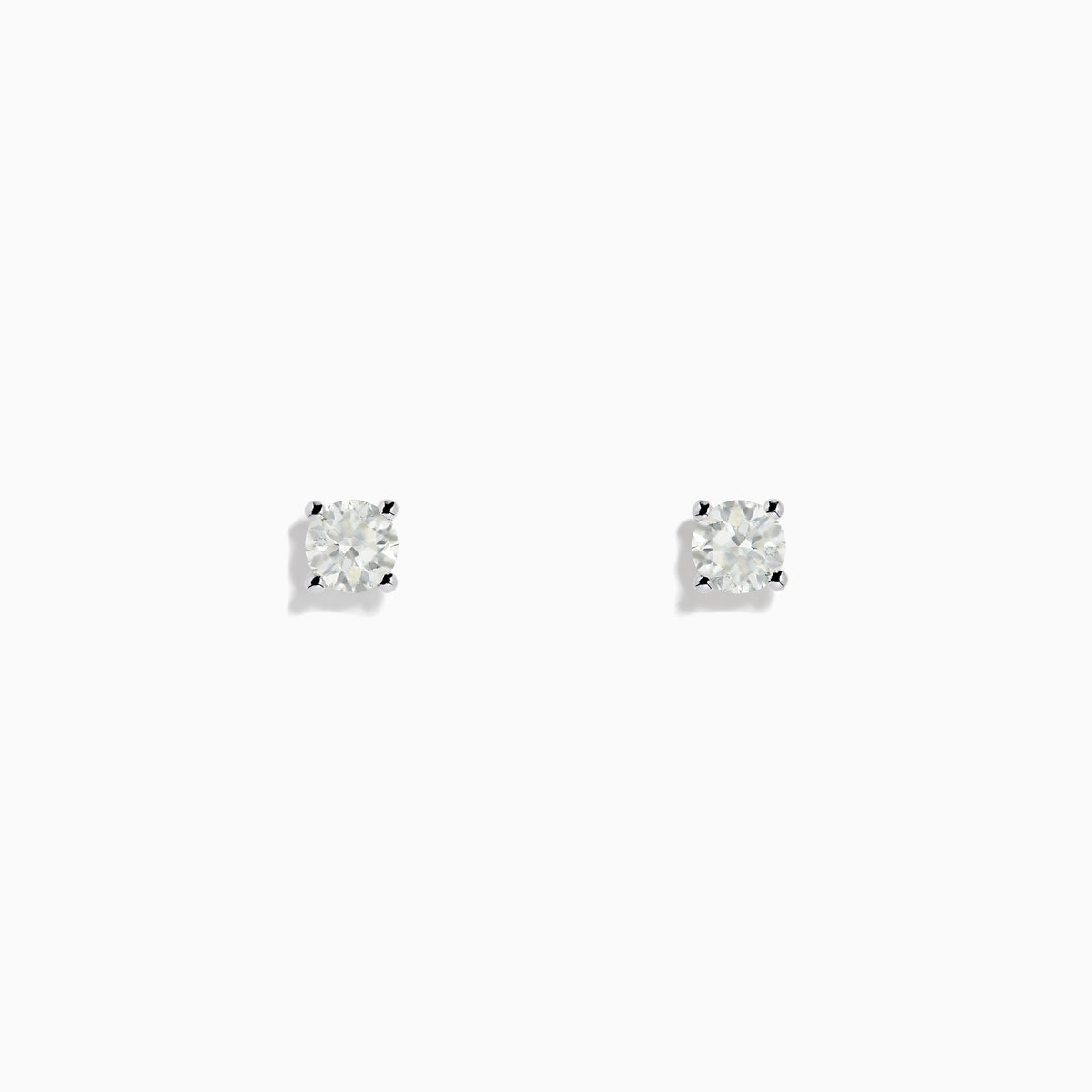 A pair of 14 Karat white gold stud earrings featuring 0.63TCW round diamonds is displayed on a simple white background, highlighting their timeless elegance.