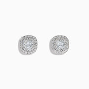 The 18K White Gold Diamond Double Halo Cushion Stud Earrings feature cushion-cut diamonds surrounded by double halos of smaller diamonds, set in 18K white gold and displayed on a white background.